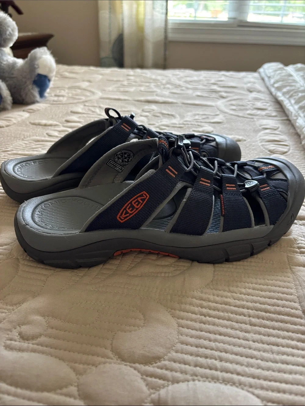 Keen Men's Closed-Toe Slide Sandals in Black with Orange Accents